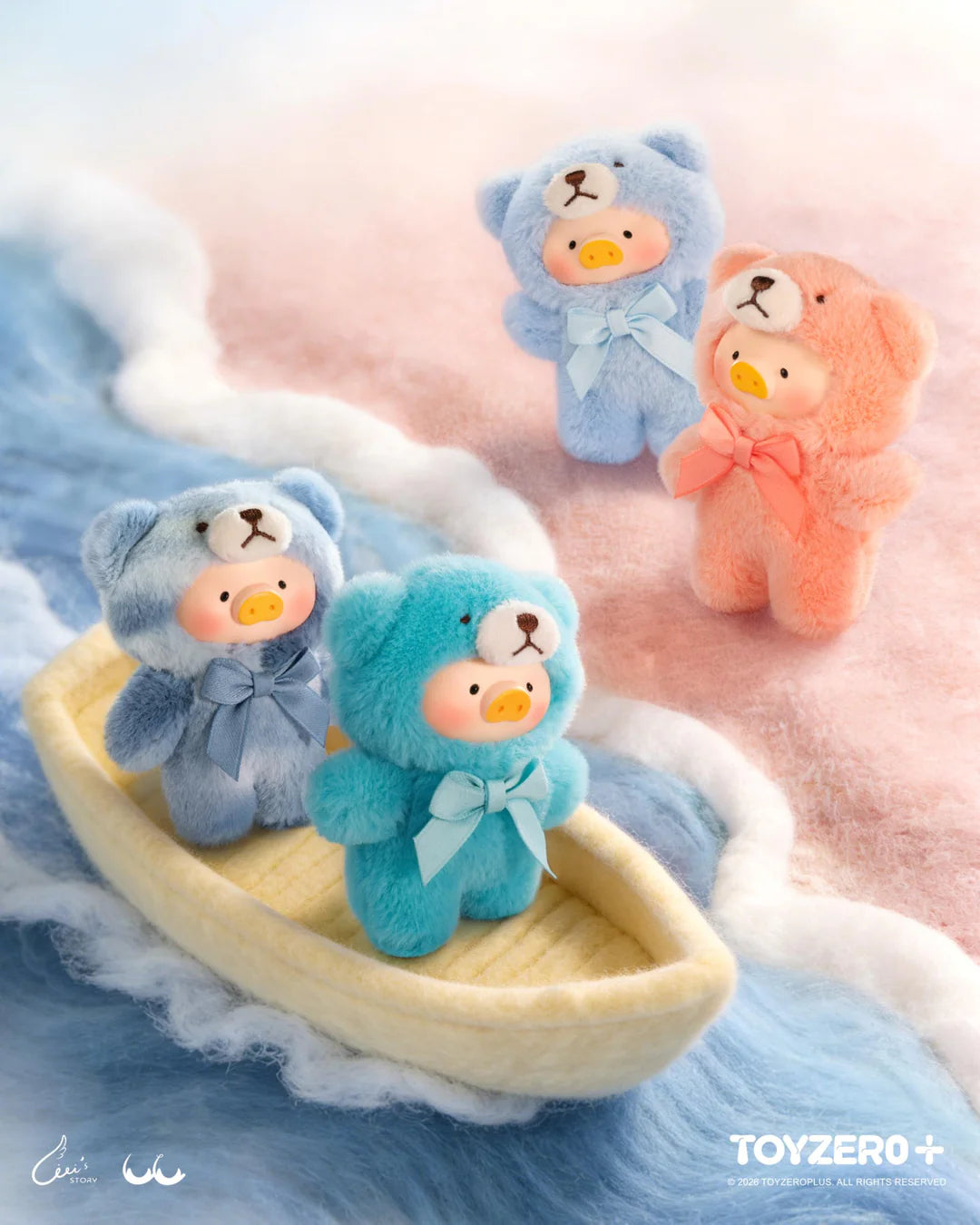 LuLu The Piggy teddy bear figures in blue, aqua and pink colorways displayed on a pastel-themed scene