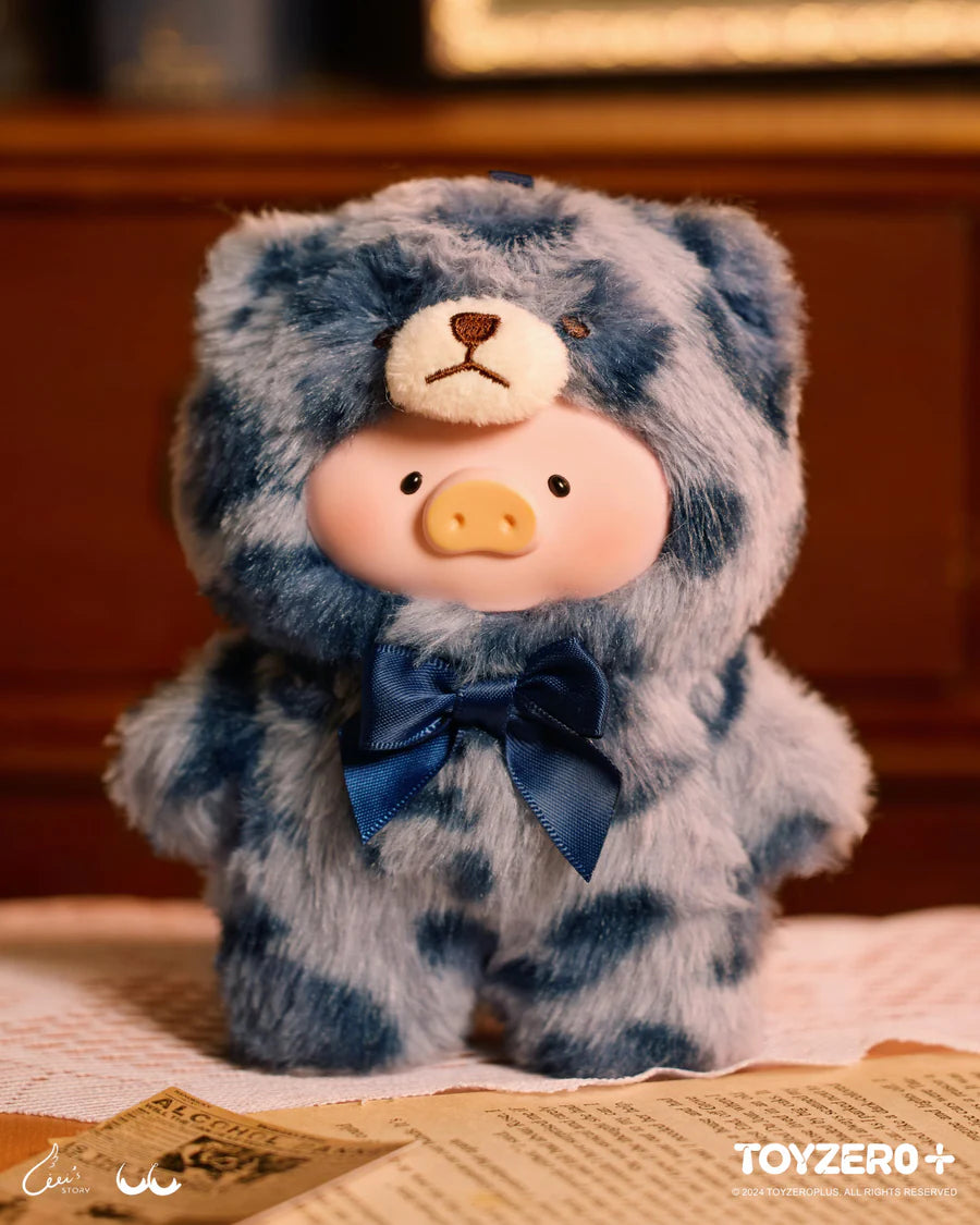 LuLu the Piggy Vintage Teddy Shop plush in light blue teddy bear outfit with blue ribbon.