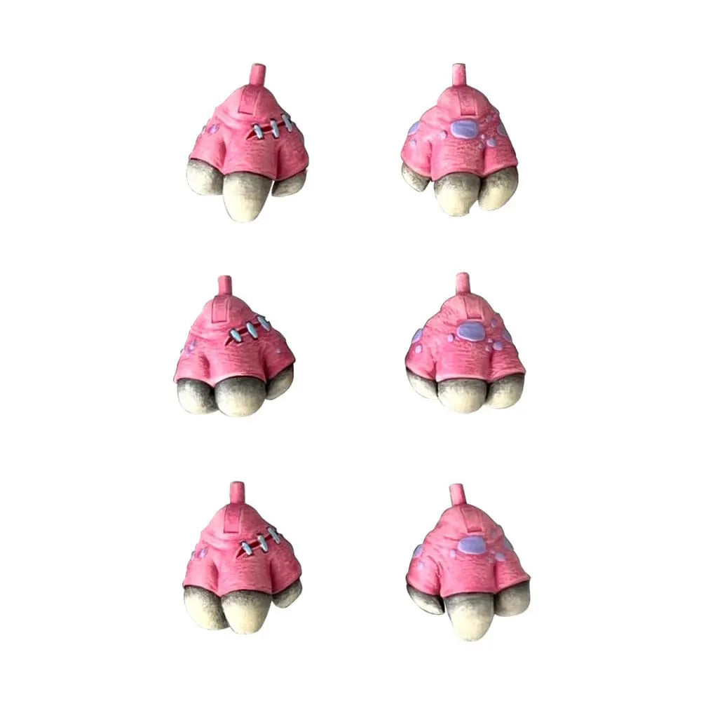Close-up view of six interchangeable hands for Swine Sucker Madballs figure, pink with stitches and details.