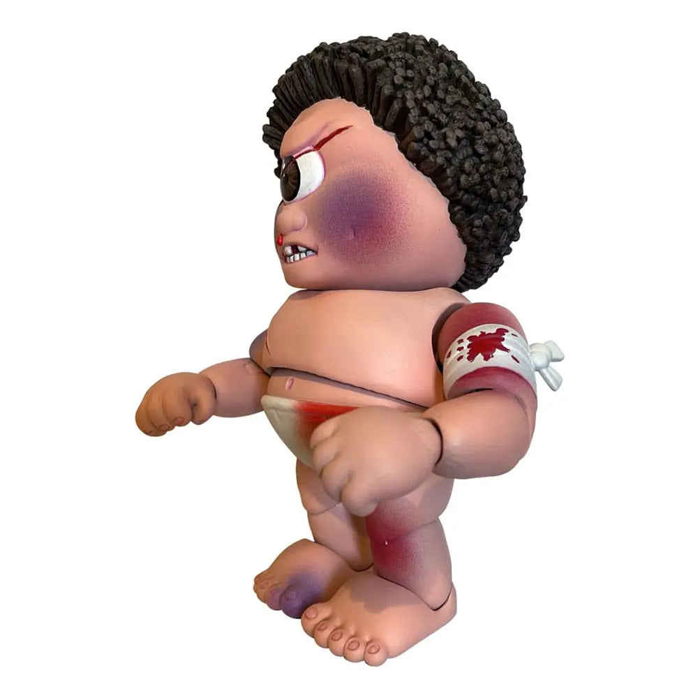 Side view of Sy Clops figure showing bloodied bandage on arm