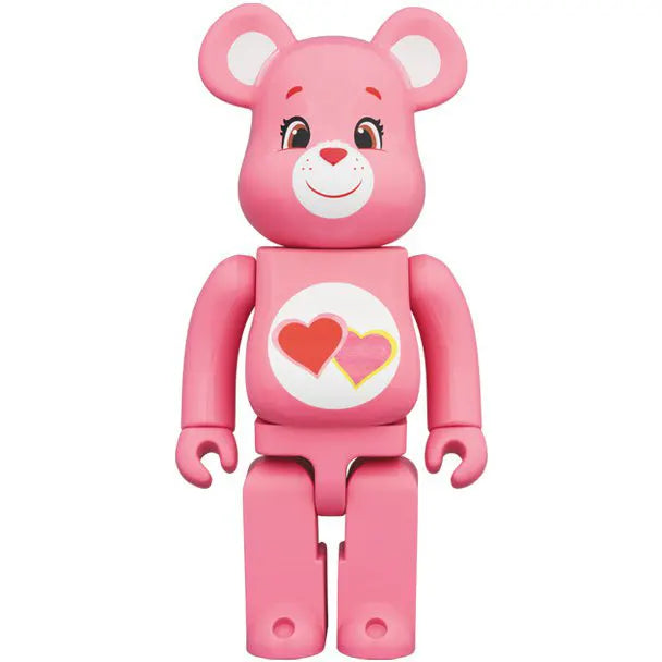 Front view of Medicom Toy Bearbrick 1000% Love-a-Lot Bear Care Bears edition with pink coat and double heart belly badge.