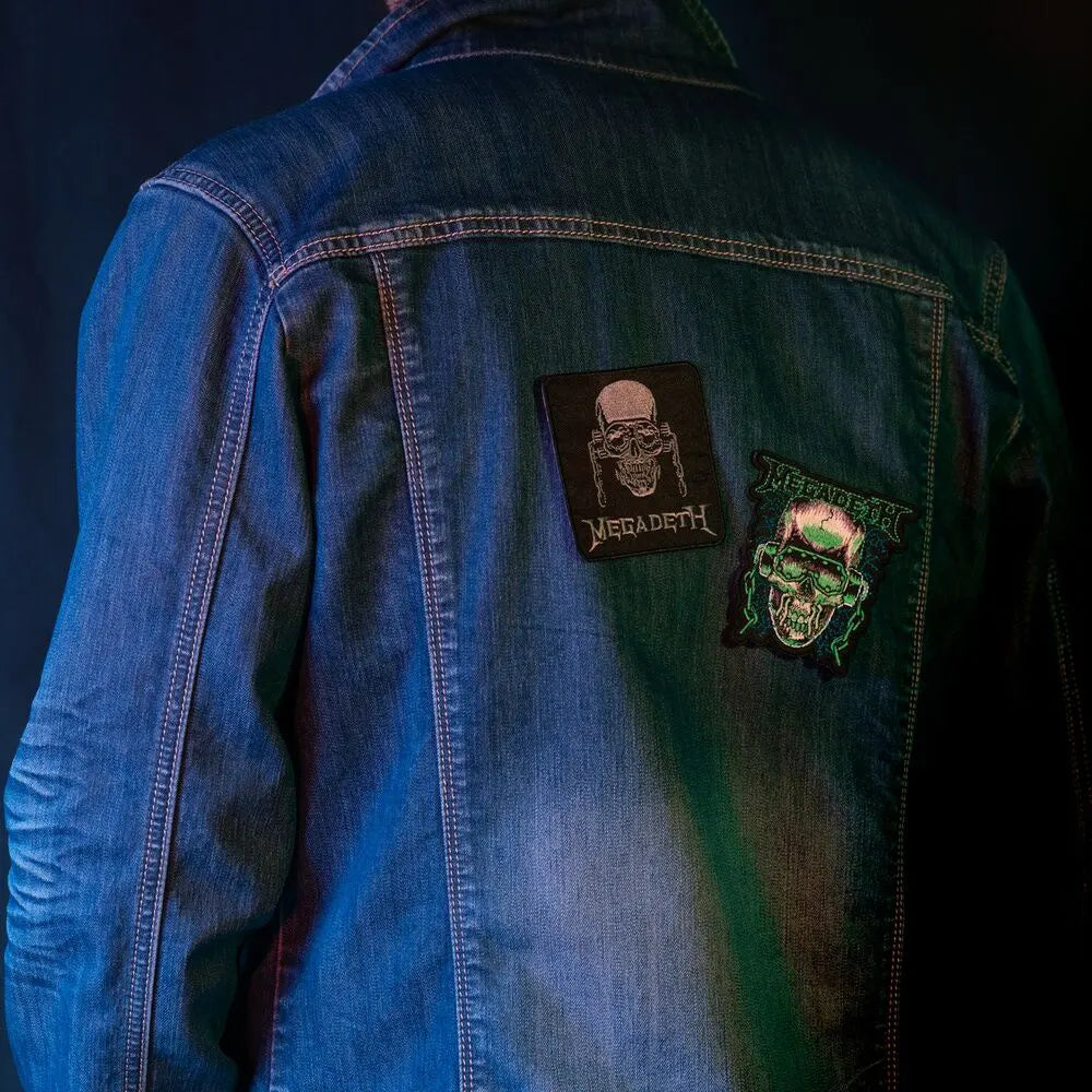 Megadeth Vic Rattlehead and skull patches on the back of a denim jacket