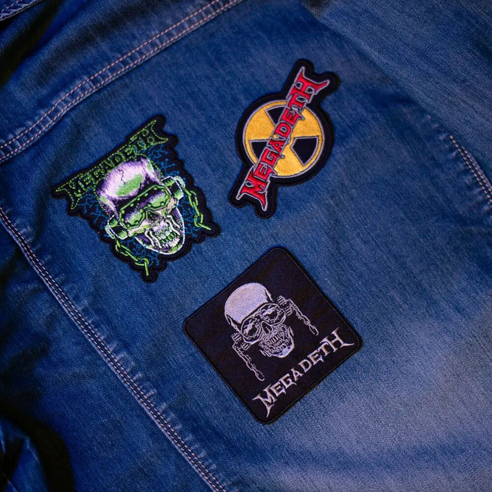Close-up of colorful Megadeth Vic Rattlehead patch on denim fabric