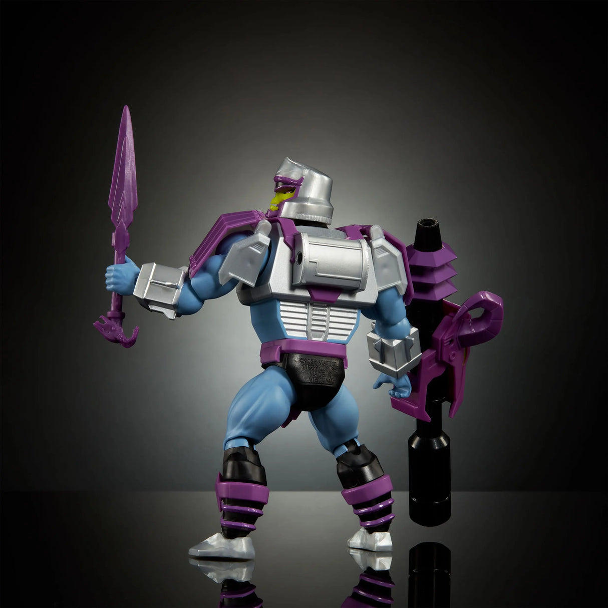 Back view of Megatron Armor Skeletor holding sword with cannon mounted behind.