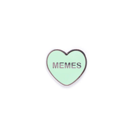 Green heart-shaped enamel pin with MEMES text by Yesterdays