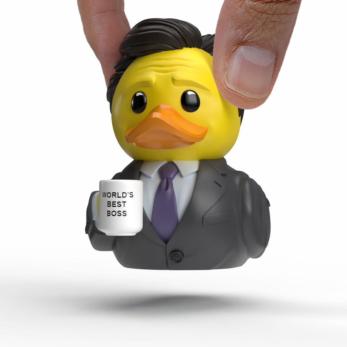 Close-up of Michael Scott Mini TUBBZ being held between fingers.