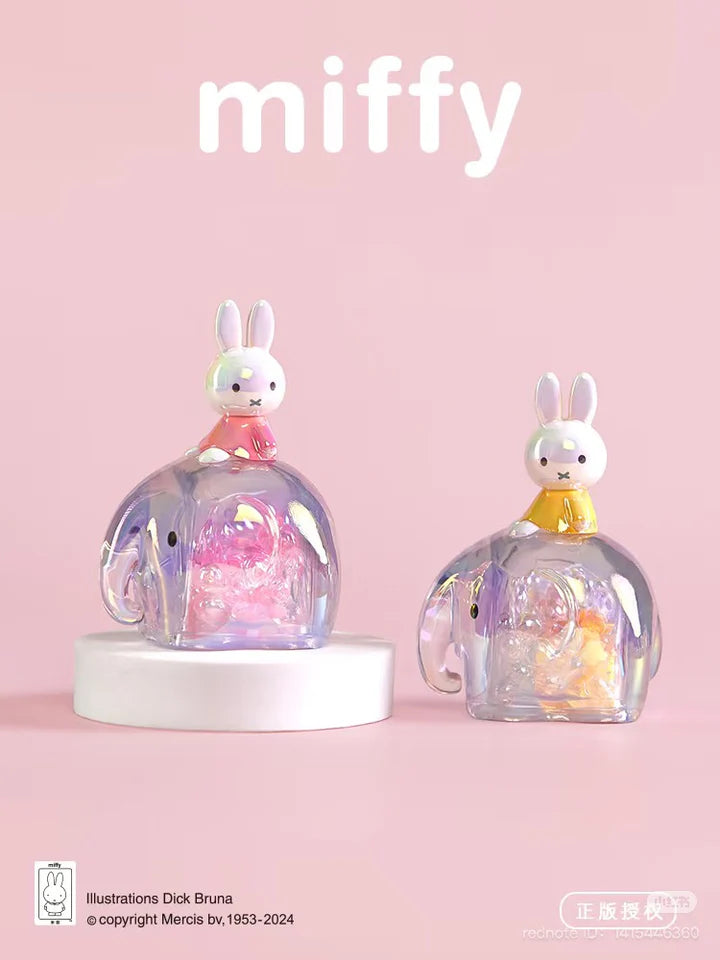 Miffy collectible figures sitting atop pink and yellow translucent elephant companions from the Elephant Series