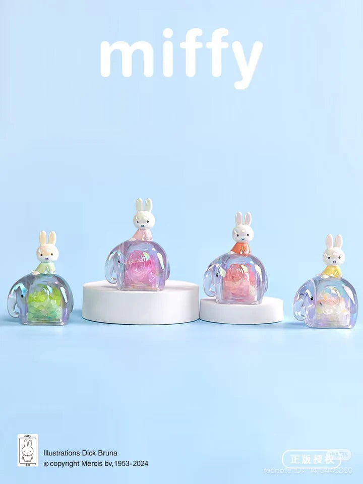 Four Miffy Elephant Series Blind Box figures displayed on white stands against a pastel blue background