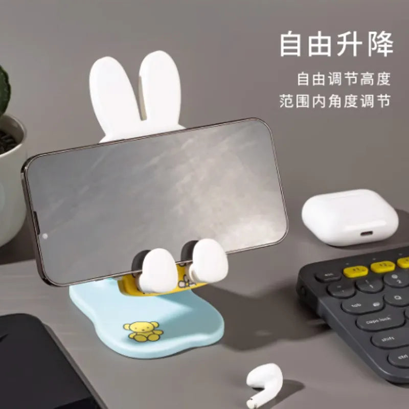 Miffy folding phone stand holding a smartphone in landscape orientation with adjustable viewing angle