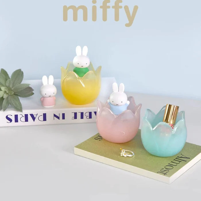 Miffy Tulip Series figures displayed alongside books, jewelry, and decorative accessories