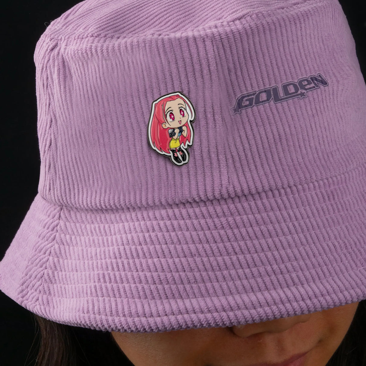Mira pin attached to pink bucket hat outfit styling