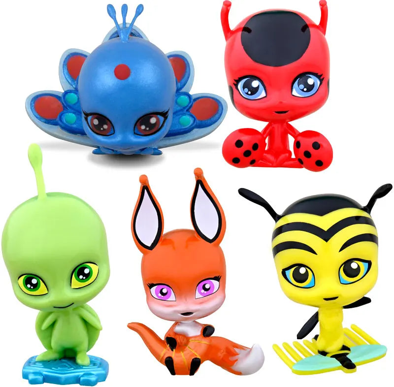 Close-up of five Miraculous Kwami figures including Tikki and Wayzz
