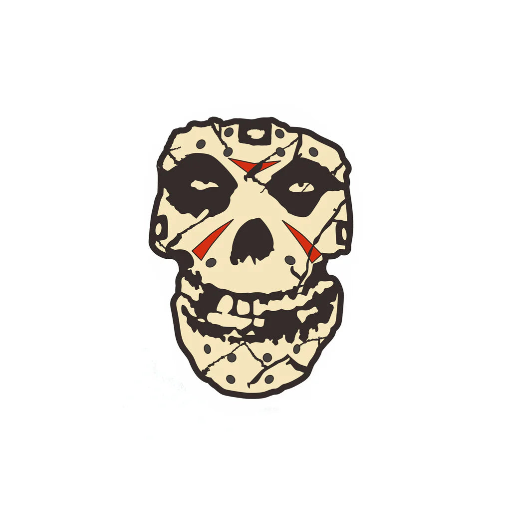 Misfits Fiend Skull enamel pin styled as a cracked hockey mask with red slashes