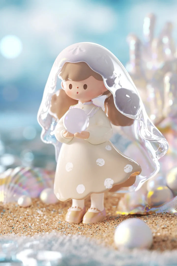 Molinta Natural Series pearl-inspired figure holding a pearl beneath a shimmering translucent veil