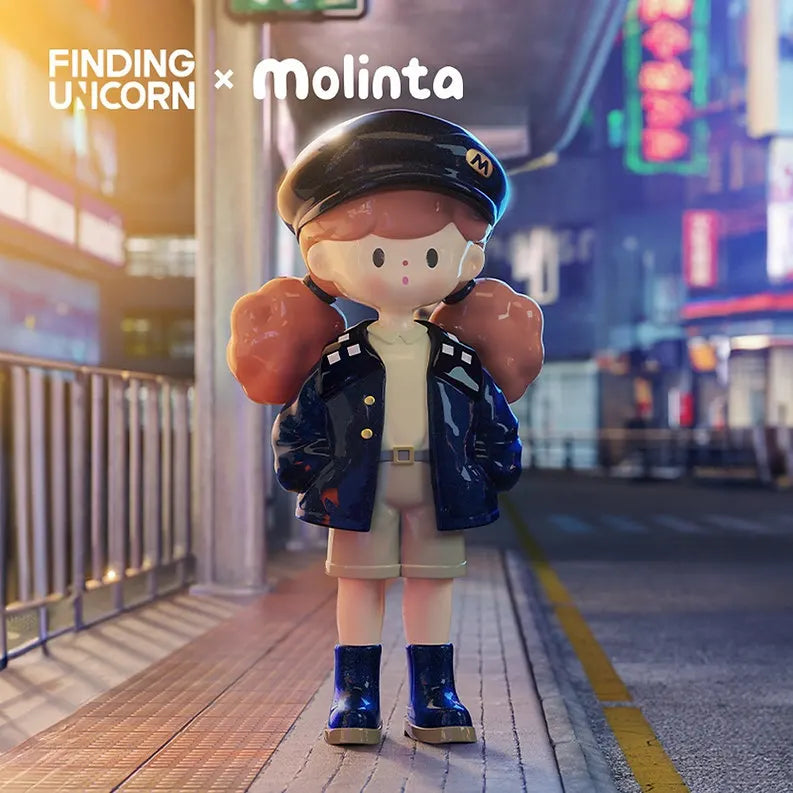 Molinta Retro Girl vinyl figure dressed in a navy cap, leather jacket, and shorts, posed in a neon-lit city street.