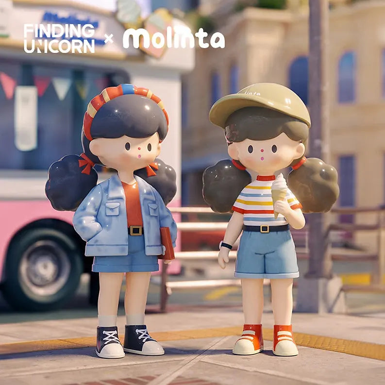 Two Molinta Retro Girl vinyl figures—one in a denim jacket with shorts, the other in a striped shirt with shorts and a cap.
