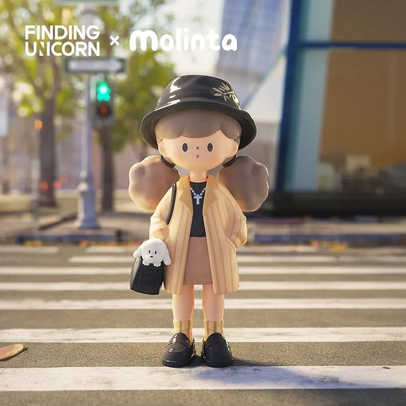 Molinta figure in chic beige coat and black hat holding a small plush accessory.