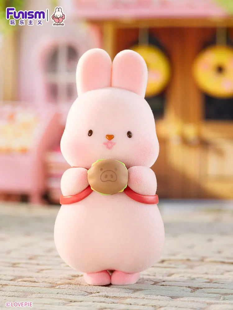 Momo Bunny Strawberry Town blind box figure holding donut.