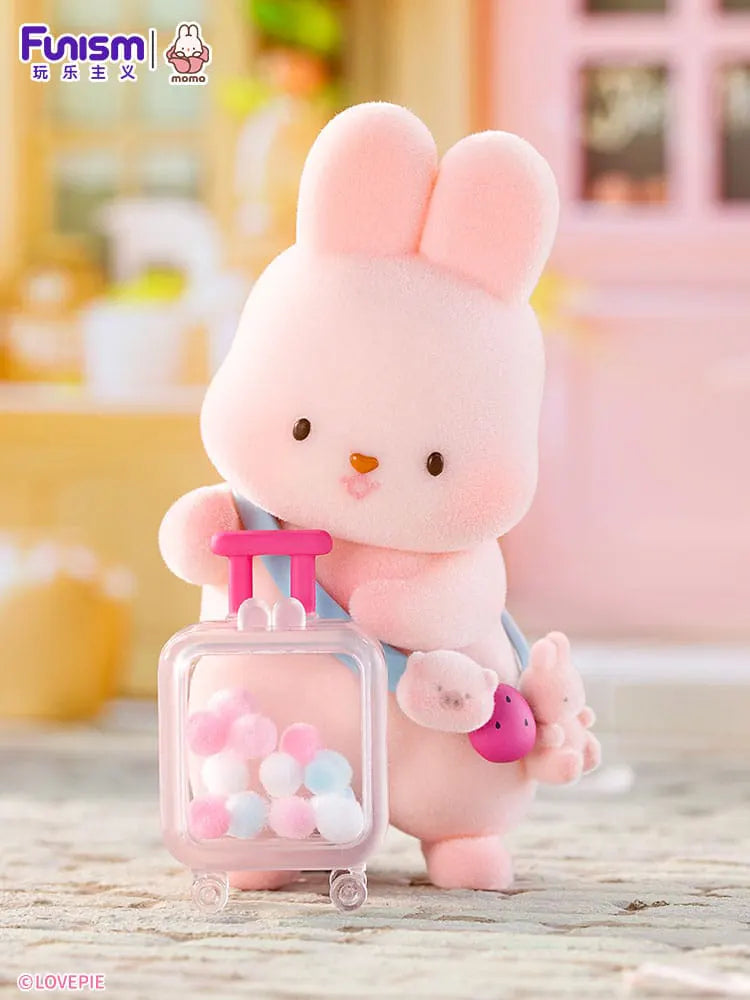 Momo Bunny Strawberry Town collectible figure with suitcase.