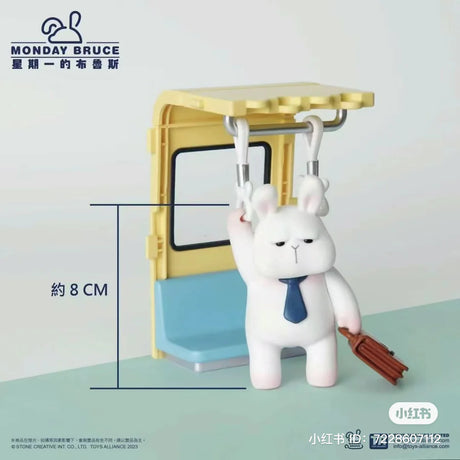 Monday Bruce figure standing in subway holding onto straps