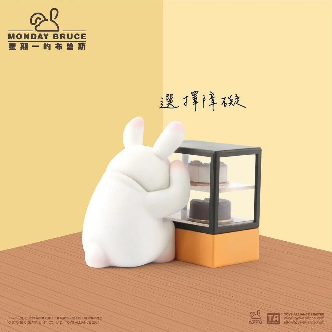 Monday Bruce figure standing in front of pastry display case, Too Many Choices design.