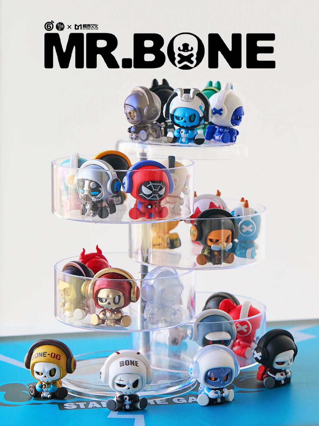 Collection of Baby Bone figures on clear tiers with Mr. Bone logo background.