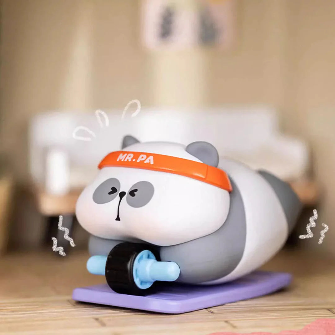 Mr. Pa vinyl figure working out with an ab roller and wearing an orange headband.