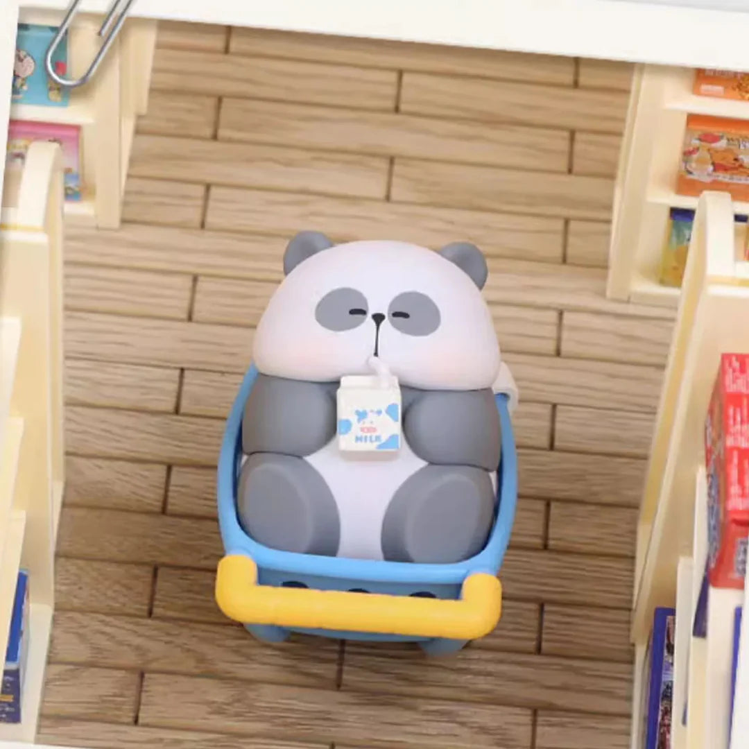 Mr. Pa panda figure taking a nap inside a shopping cart while drinking milk.