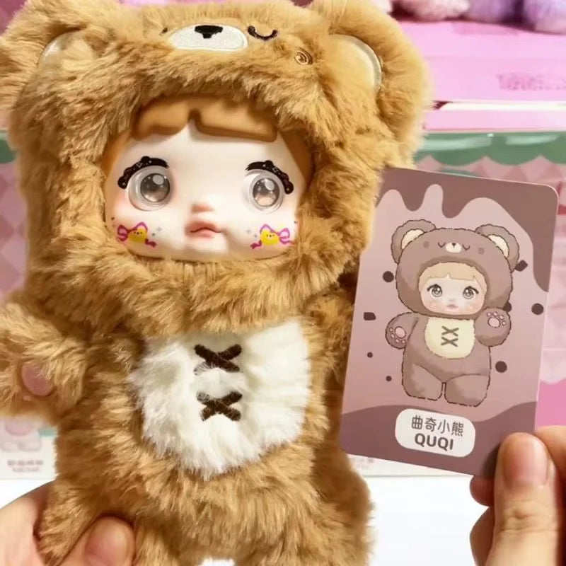 Close-up of Cookie Bear Quqi plush keychain with matching collector card.