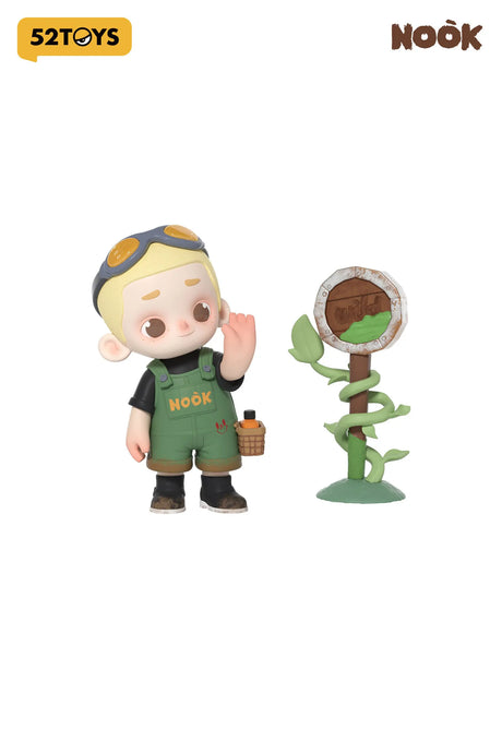 Cute vinyl figure of Nook in green overalls with a wild signpost from Wasteland Park series.