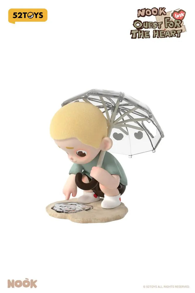 Nook kneeling with umbrella peering into puddle – blind box figure by 52TOYS