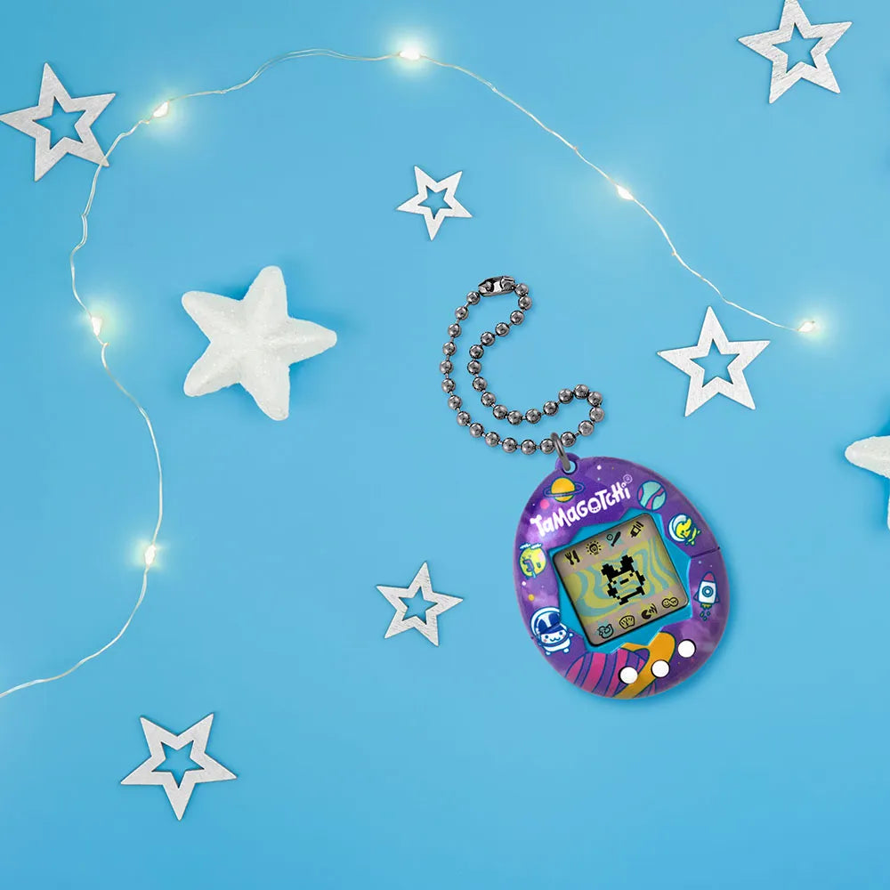 Tamagotchi Tama Universe displayed on blue background with star decorations.