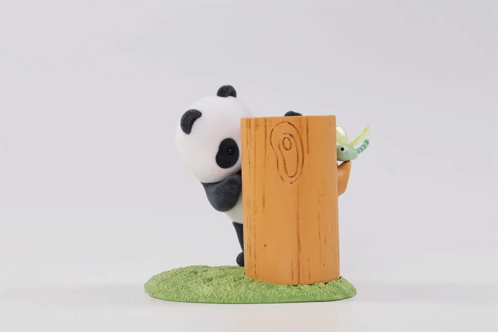 Panda climbing with a curious look in a forest-themed figure