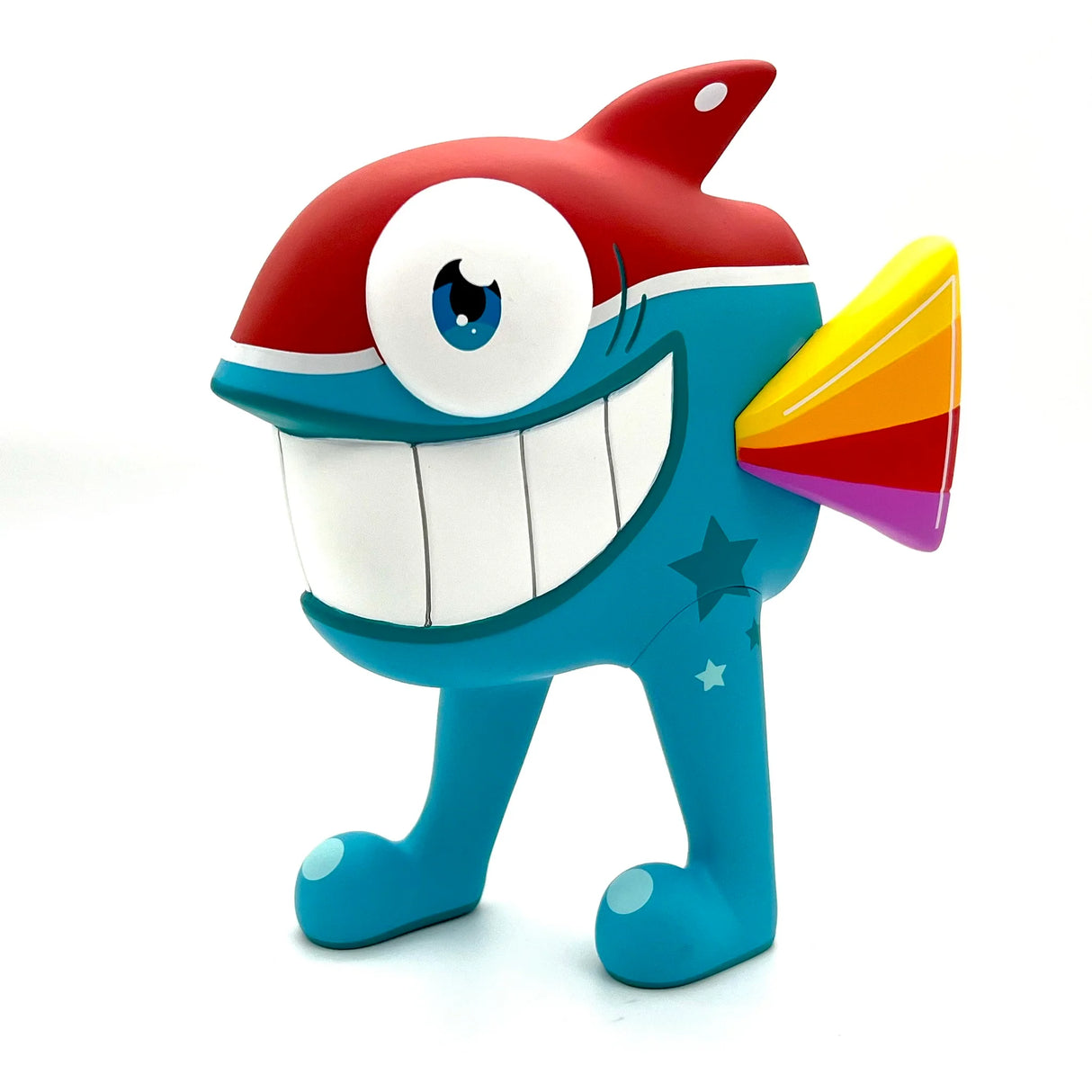 Left side view of Pez Walking Fish Tropical vinyl toy showing red fin and smiling face