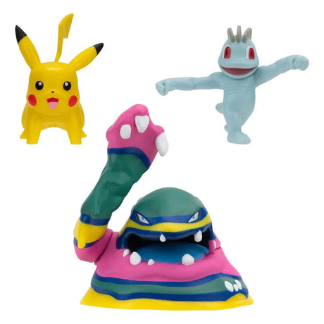 Loose Pokémon mini figures of Machop, Pikachu, and Alolan Muk from the Battle Figure Set.