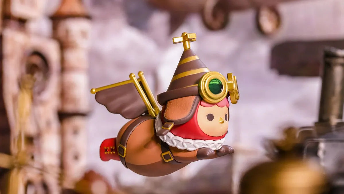 Steampunk-themed Pucky Flying Baby with aviator goggles, brown outfit, and golden propellers.