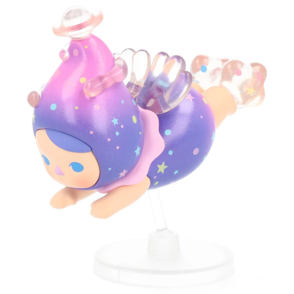 Dream Fairy Pucky Flying Baby in purple and pink cosmic outfit with translucent wings.