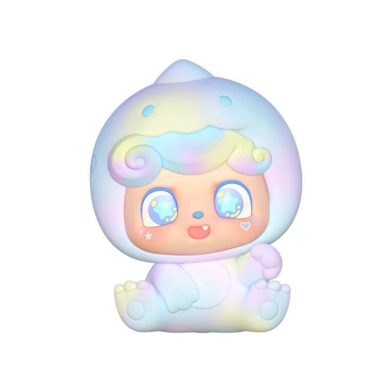 Close-up of pastel-colored Q Kid figure in sitting pose with starry eyes.