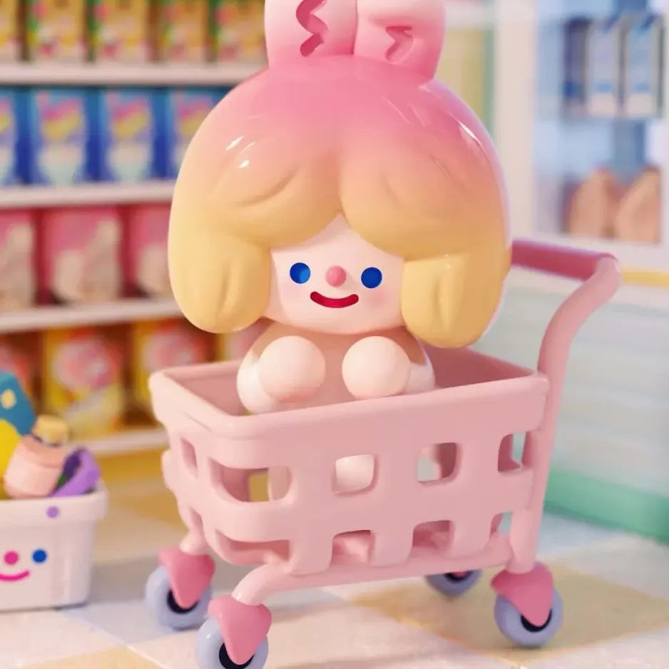 Cart Rider RiCO collectible figure riding inside a pink shopping cart at Coco Mart