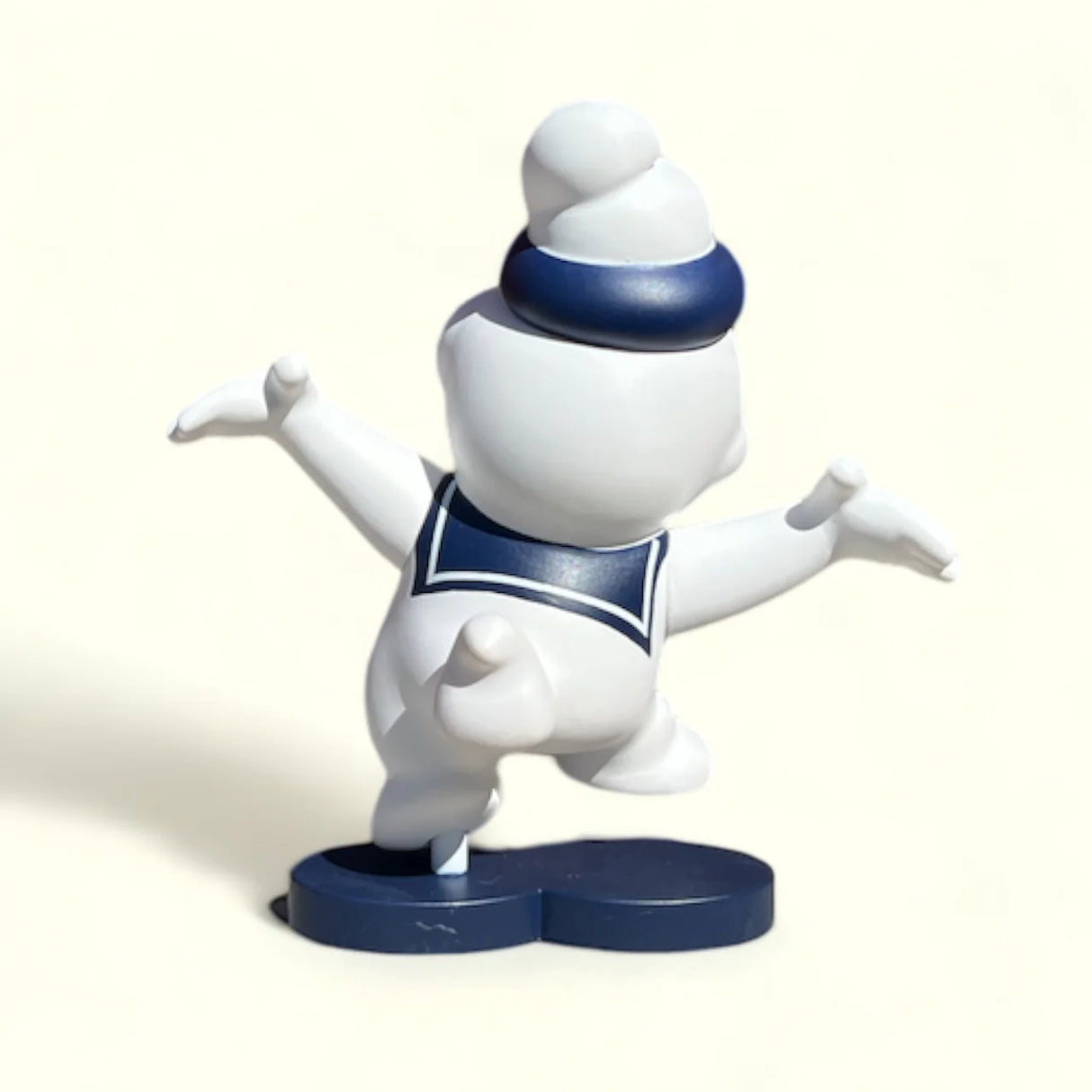 Back view of Ripple Stay Puff Edition designer vinyl figure on display base