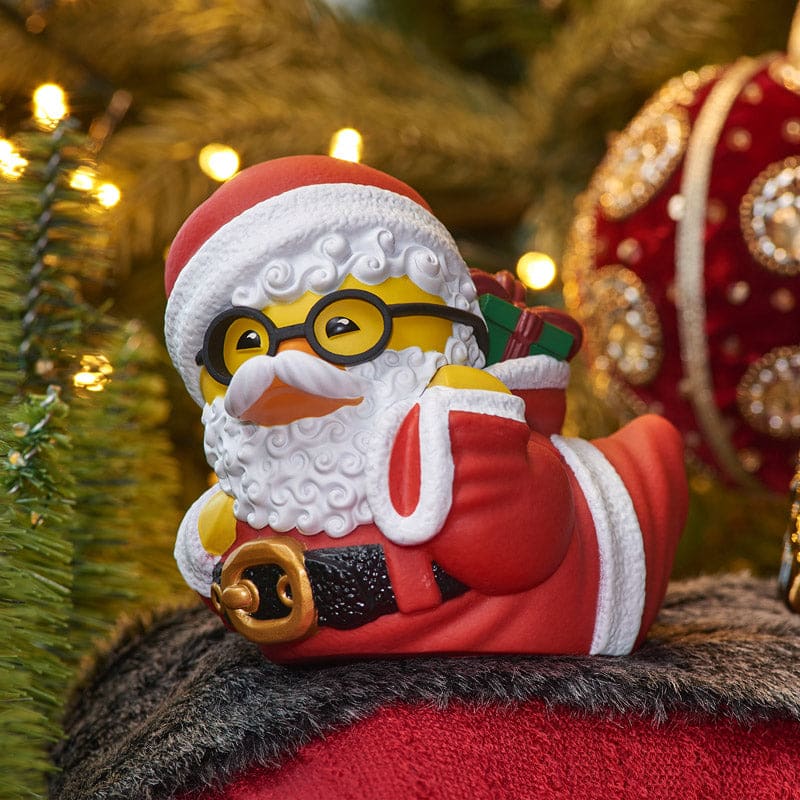 Close-up of Santa Claus TUBBZ duck figure front view with festive Christmas background.