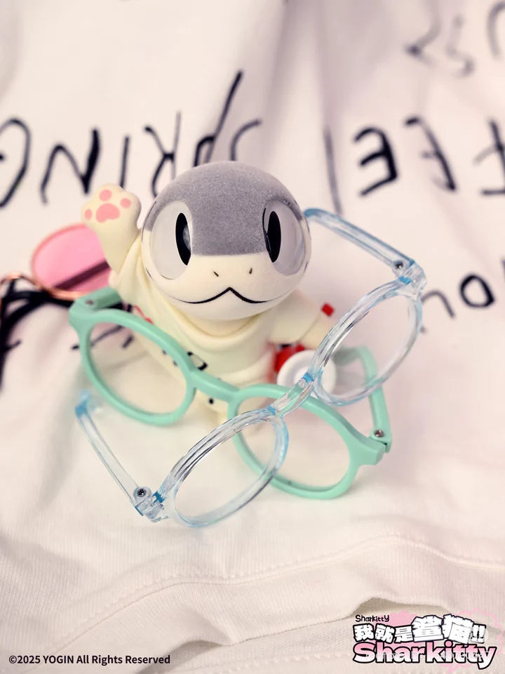 Sharkitty blindbox vinyl figure holding glasses with raised paw