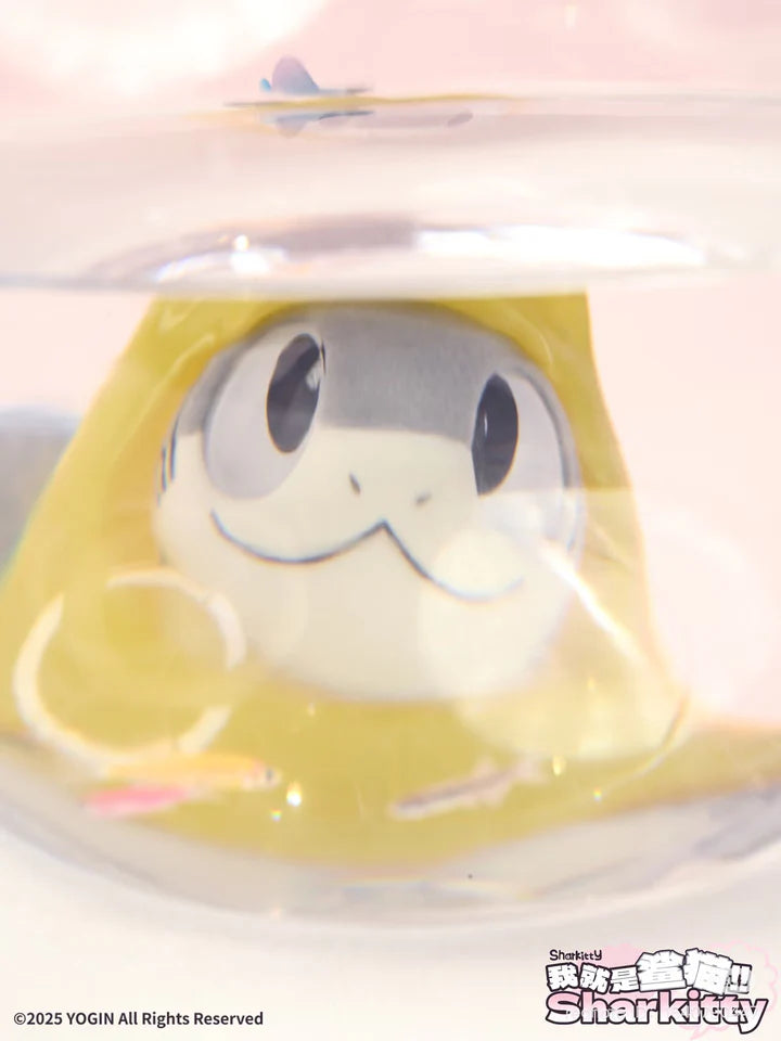 Sharkitty blindbox figure in yellow hoodie viewed underwater