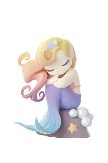 Pastel rainbow-haired mermaid elf with purple tail and sea star, representing dream element.
