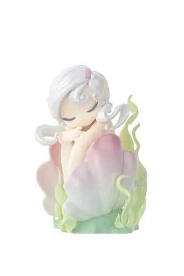 White-haired sea elf with icy tendrils sitting peacefully on ocean rocks from Sleep Sea Elves Blindbox Series.