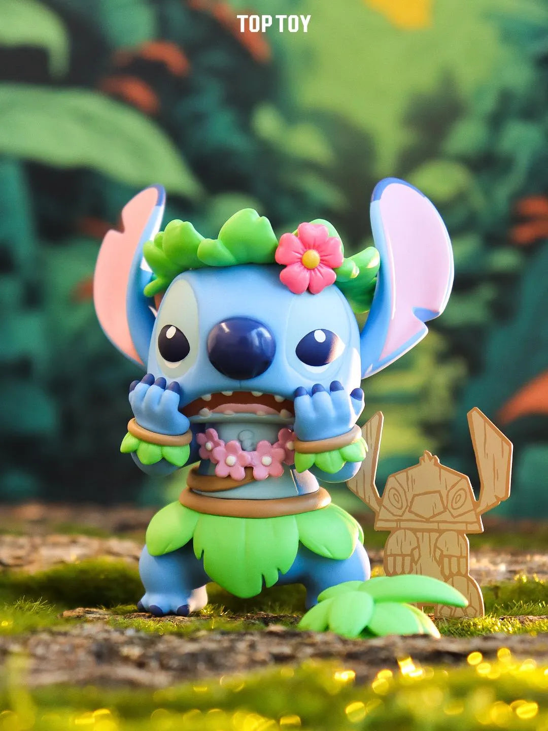 Hula Stitch collectible figure with grass skirt and tiki idol accessory.