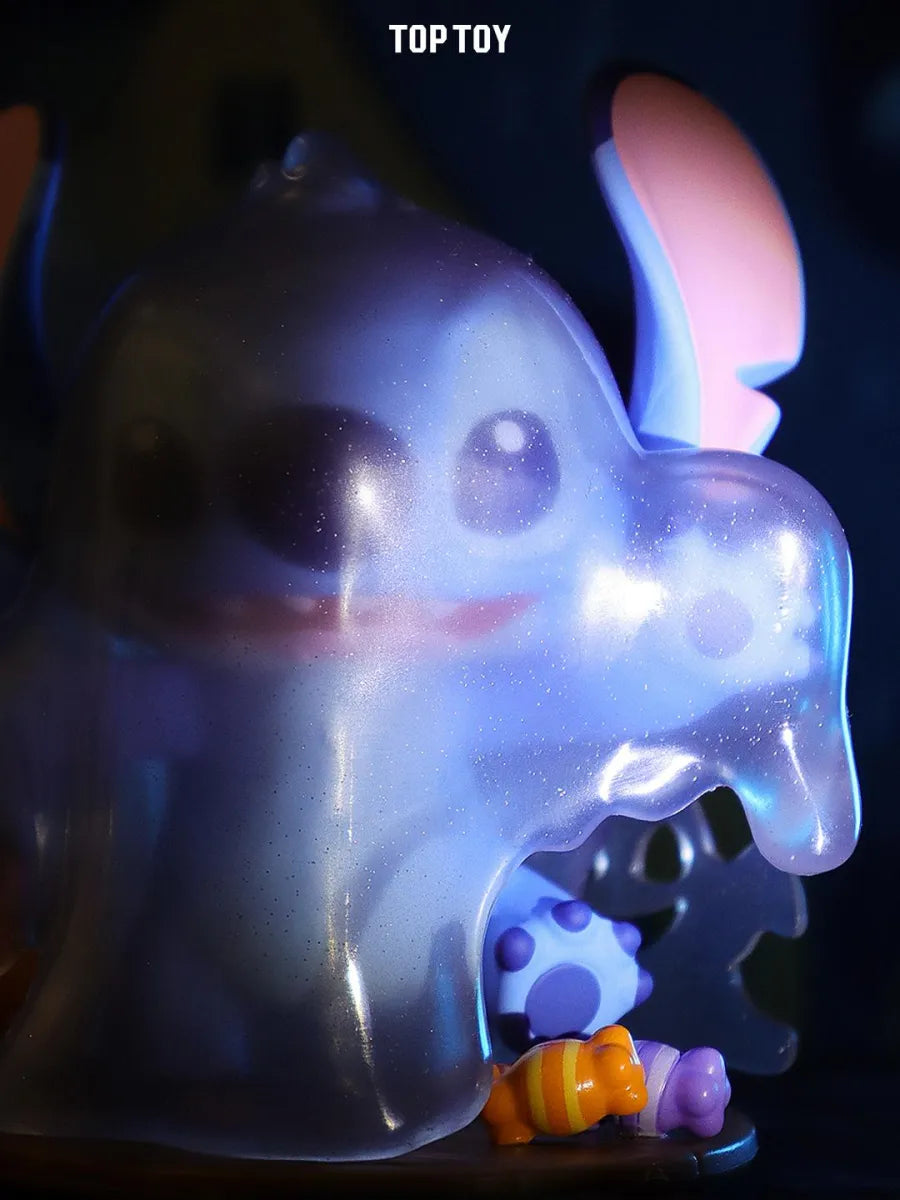 Close-up of ghost Stitch with sparkly translucent cloak holding Halloween candy.