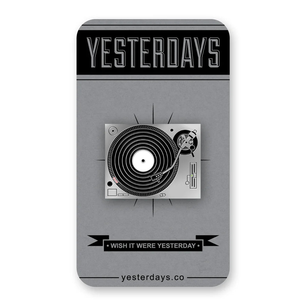 Vinyl-themed enamel pin mounted on collector card