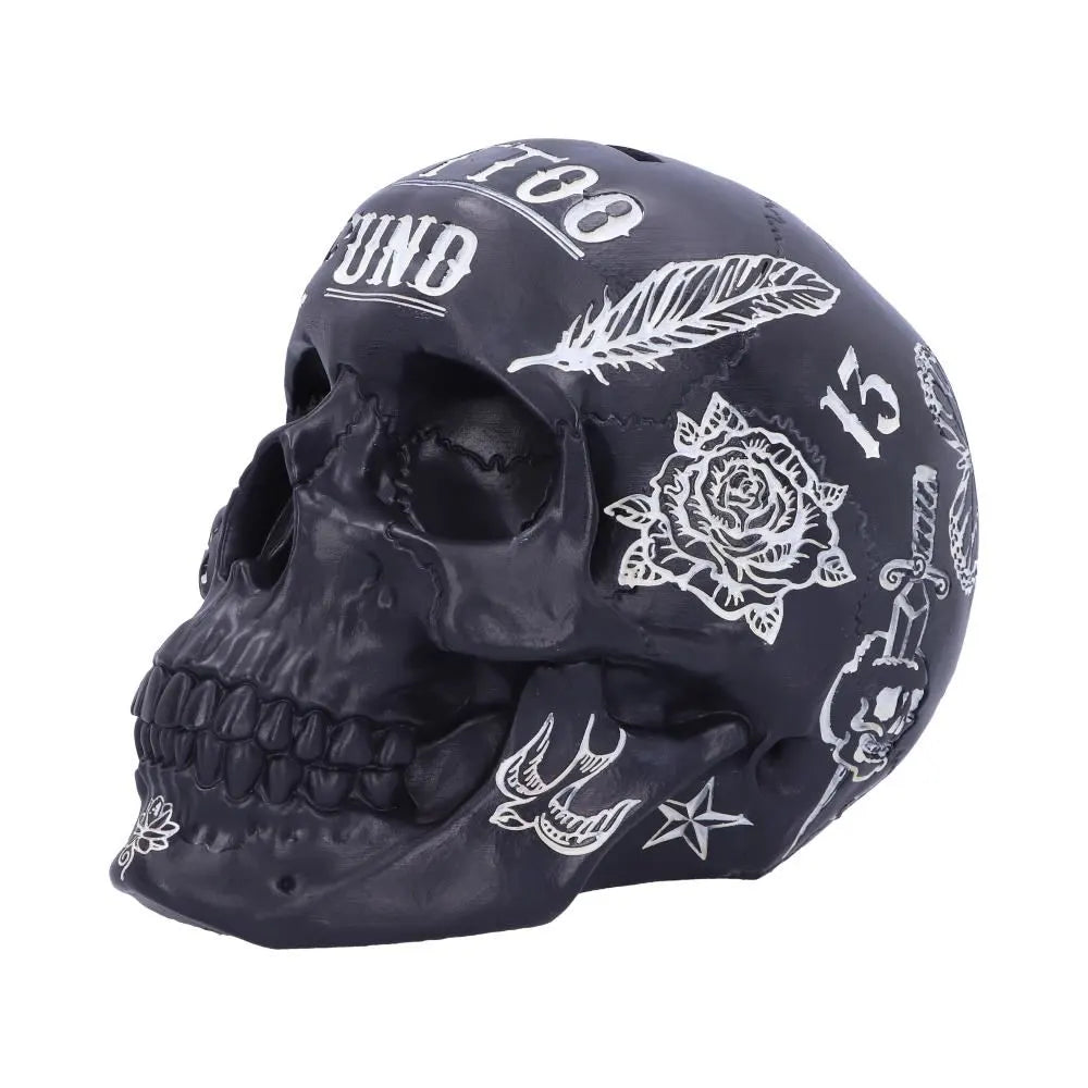 Profile view of tattooed skull coin bank