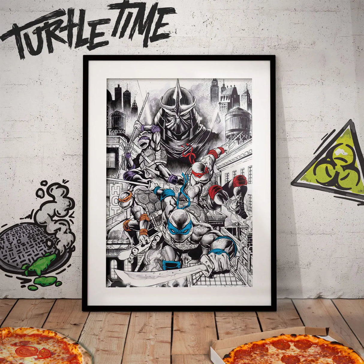 Framed Teenage Mutant Ninja Turtles 40th Anniversary Art Print displayed on a wall with pizza